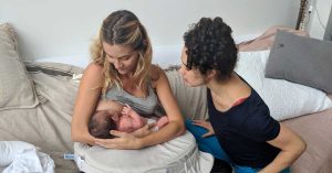 Barbara DiCreddo receiving postpartum care from Lactation Consultant, Grace MacNair. 