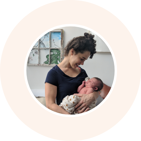 Doula caring for a newborn baby